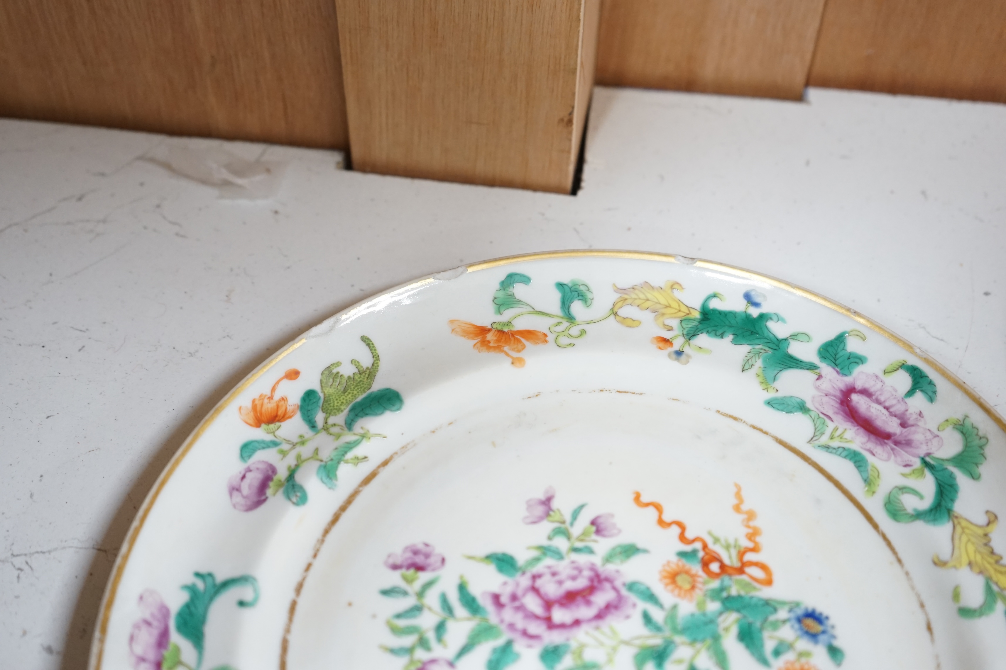 A pair of 19th century Chinese famille rose plates and another blue and white, largest 25cm diameter. Condition - blue and white good, others poor to fair